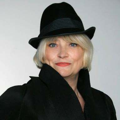 Marilyn Palmer wearing her signature black hat